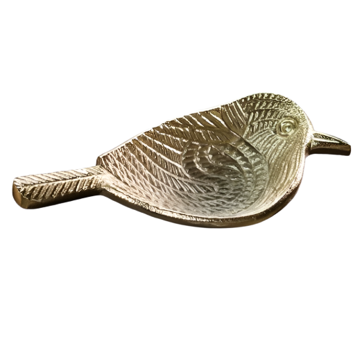 Gold leaf-shaped dish on a textured surface