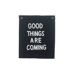 Black and white canvas wall hanging. Good things are coming