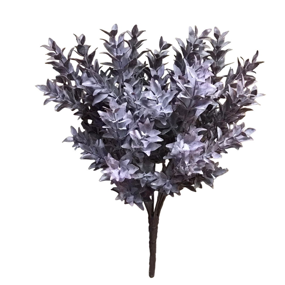Artificial purple bush on a wooden surface