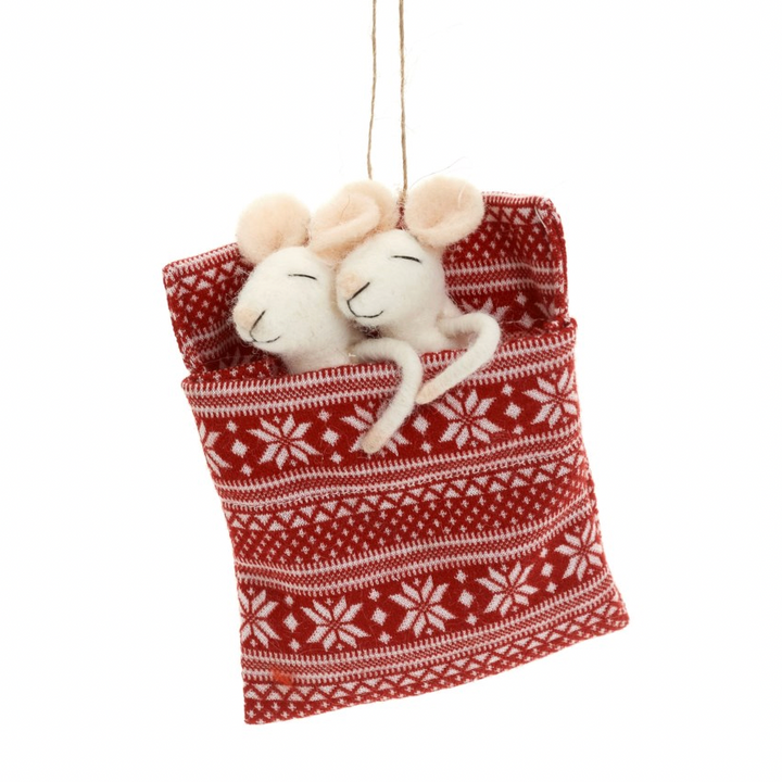 A festive red and white patterned fabric pouch ornament hanging from a string, with two cream-colored felted mouse toys nestled inside, shown against a plain white background.