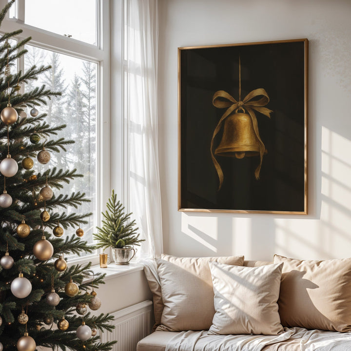 Decorated Christmas tree in a living room with a framed artwork of a gold bell.