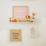 Sweet and simple girls nursery photo with darling you're magic wall hanging